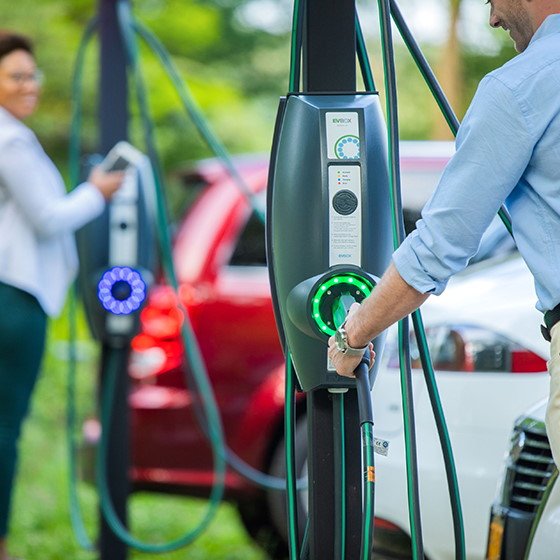 EVBox charging station in use People charging EV cars at EV charging station